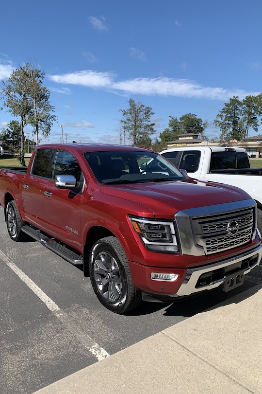Red Nissan Titan Platinum Reserve after film work