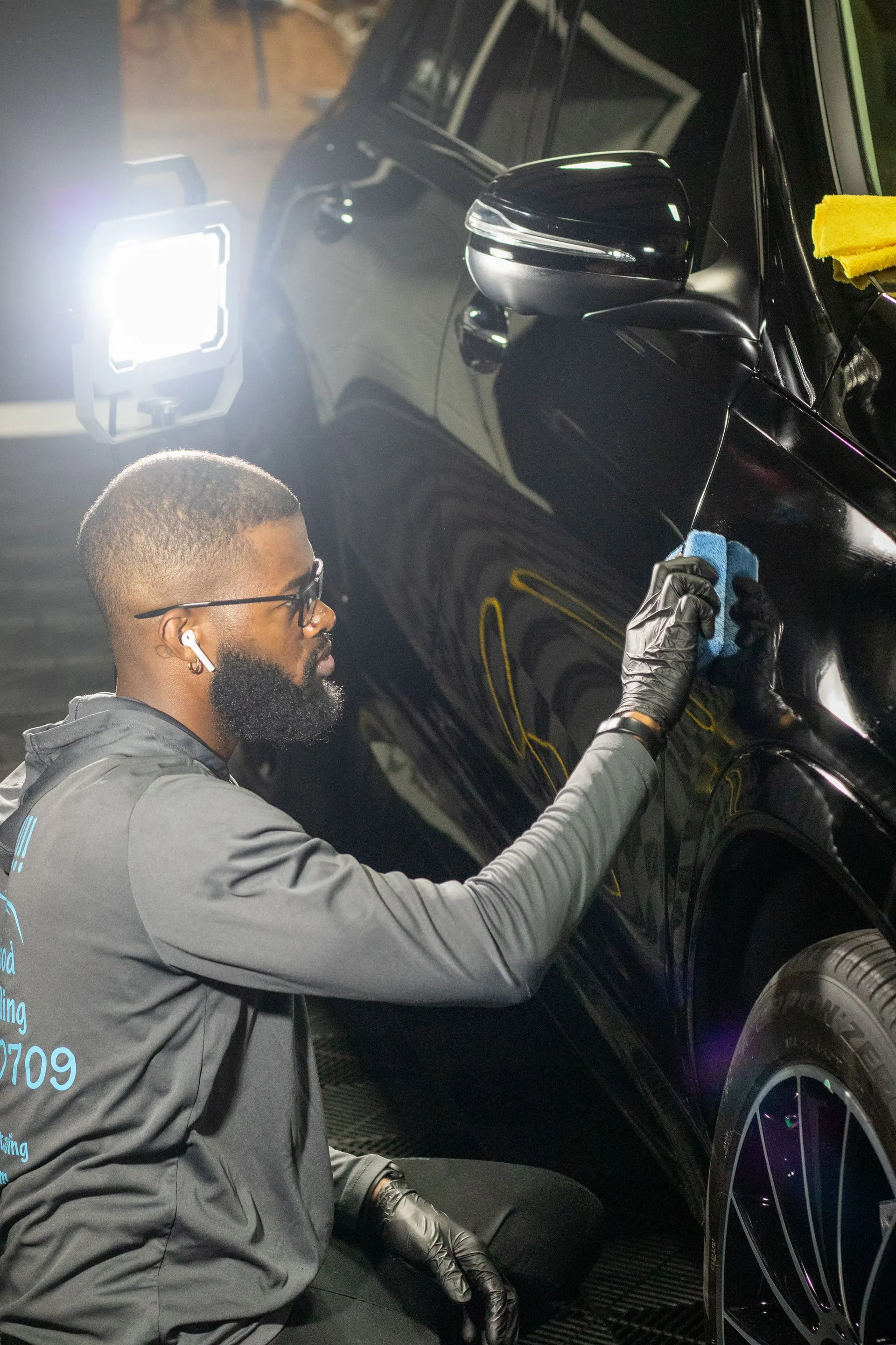 Everette Mitchum working on a vehicle