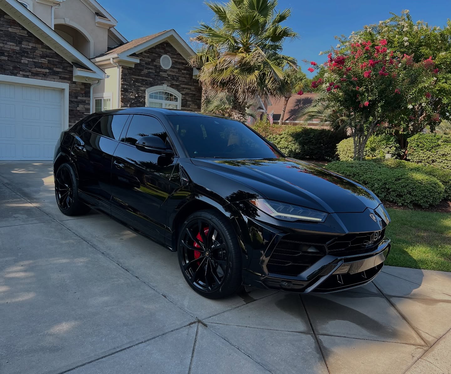 Black Lamborghini Urus outside the Conway shop