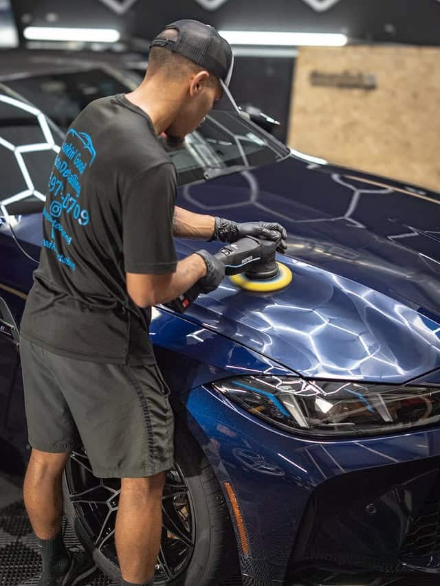 Paint correction on the hood of a blue BMW M4
