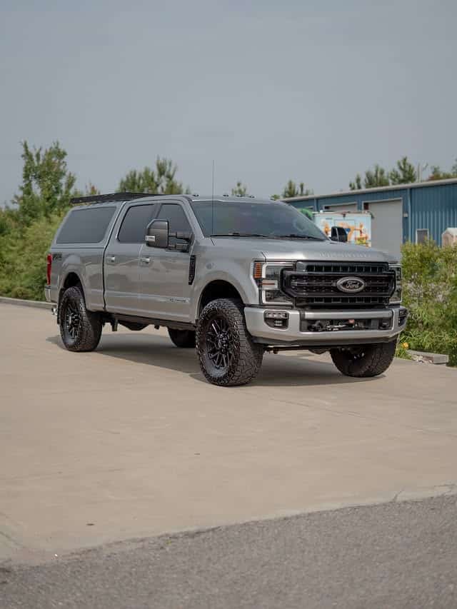 Silver Ford F-250 Tremor with a bed cap