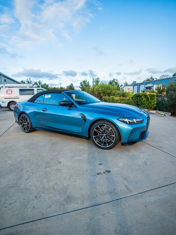 Teal BMW M4 convertible after film and coating work