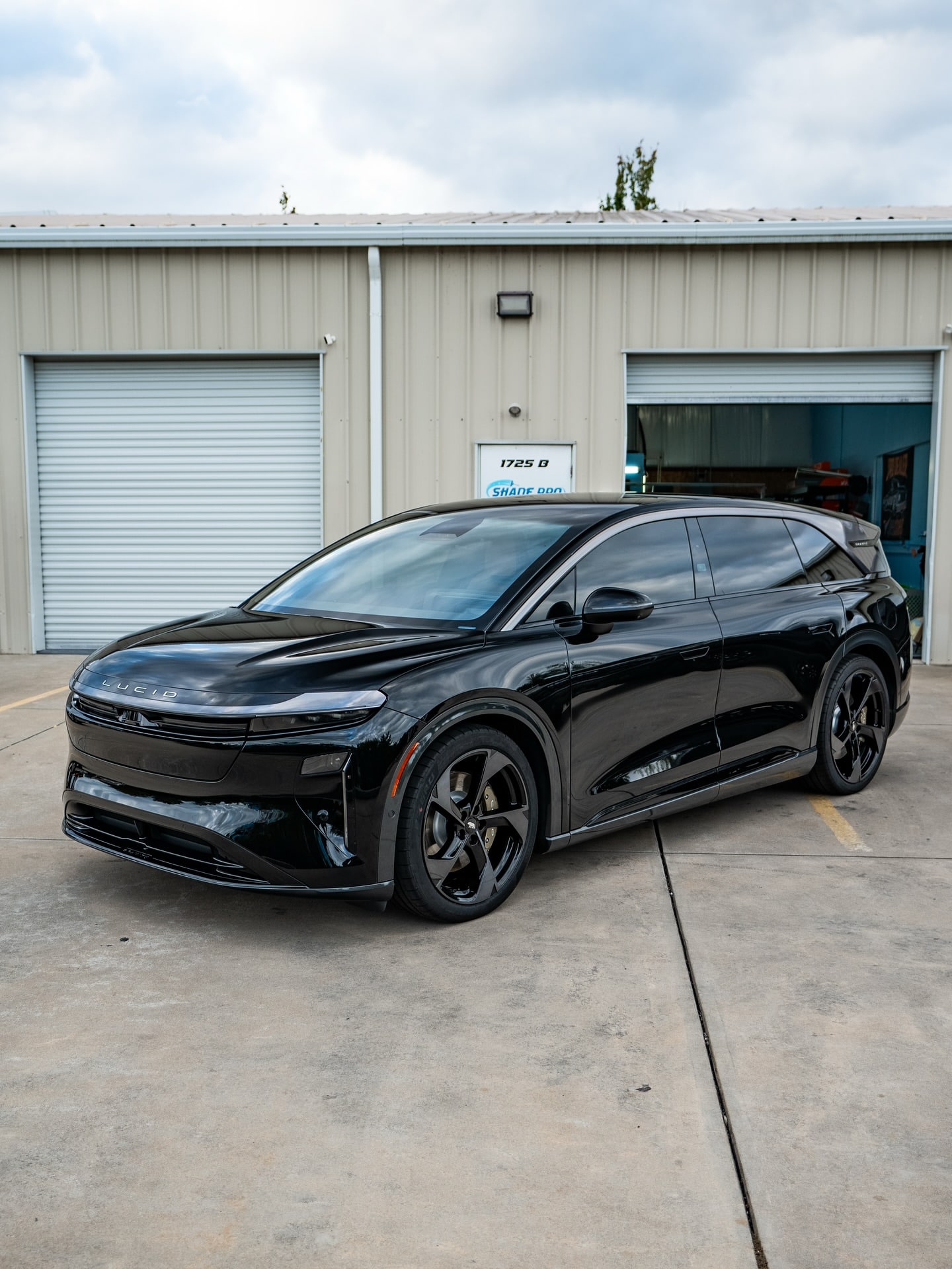 Black Lucid Gravity outside the shop bay